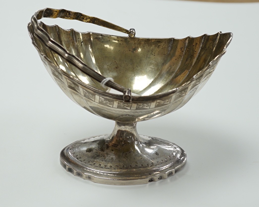 A George III Irish engraved silver bats wing oval shaped pedestal sugar basket, by Richard Sawyer, Dublin, 1803, length 17.5cm, 9oz.